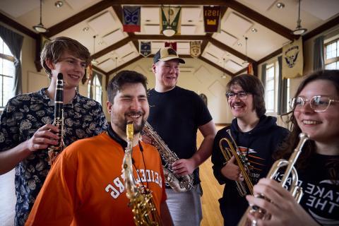 students holding band instruments